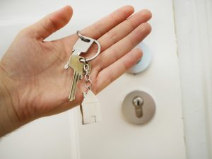 Person with house key