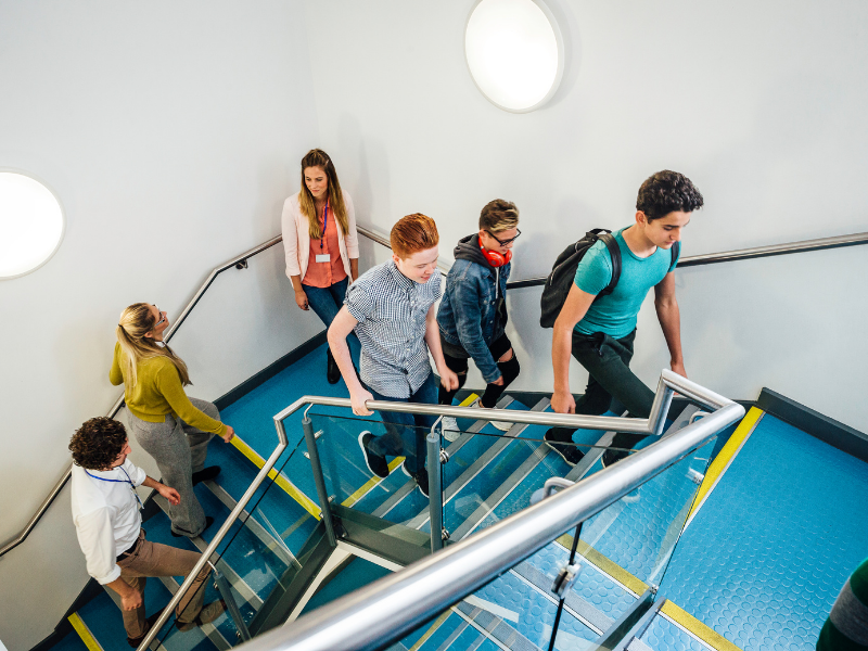 School children walking up stairs