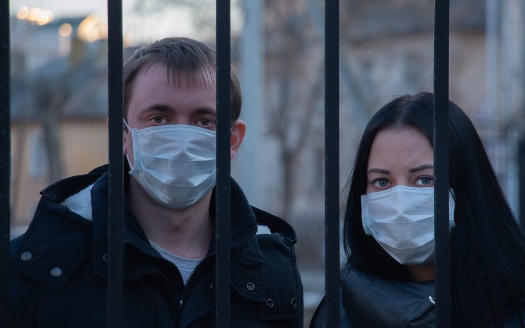 Two people in masks