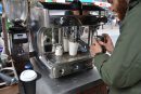 A man working at a coffee machine