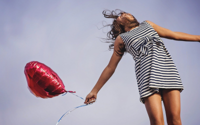 A girl holding a balloon