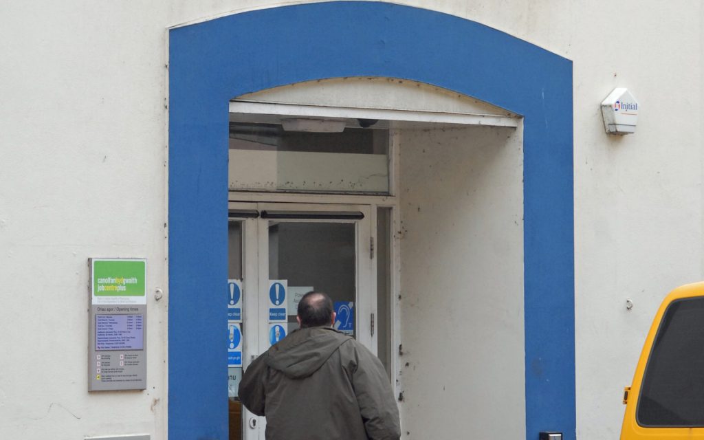 A man walking into a building
