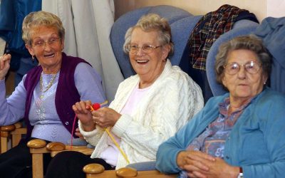 Three older women laughing