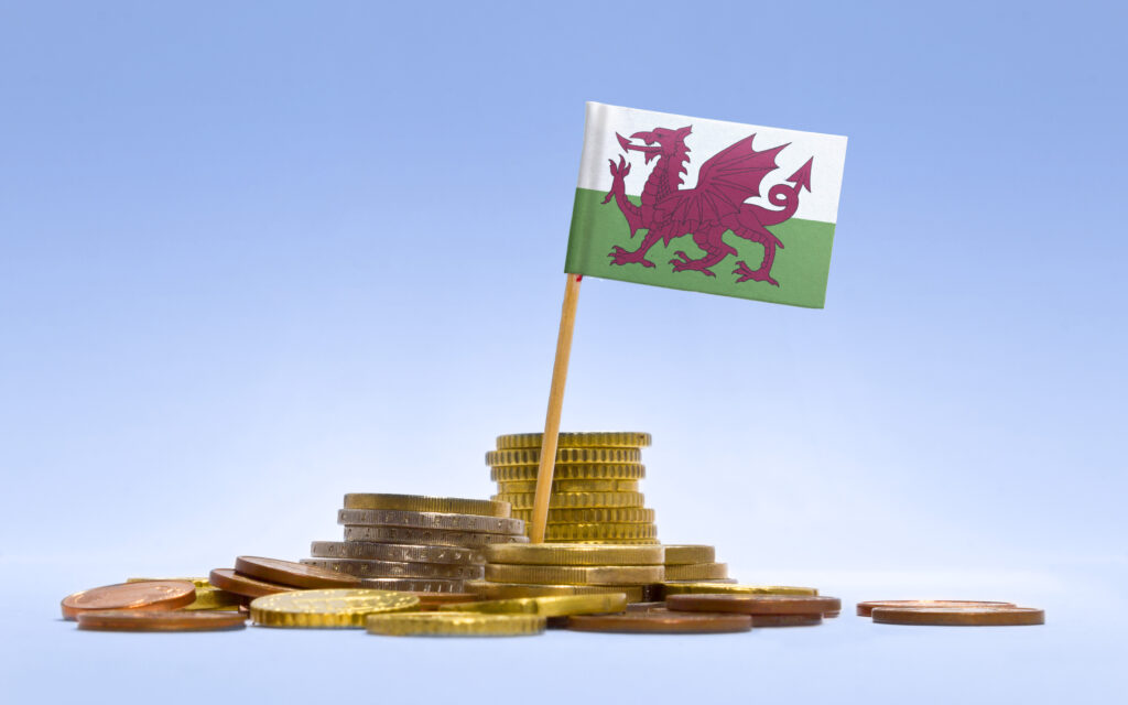 a welsh flag on top of money