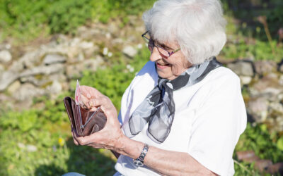 senior-woman-looking-something-her-purse