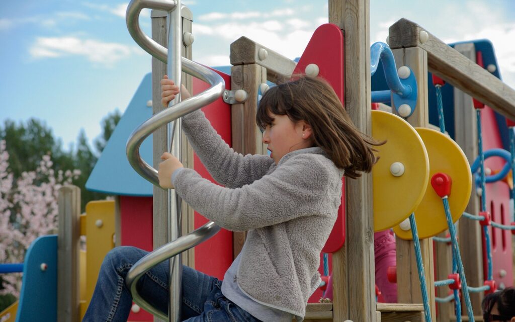Girl on a climbing frame