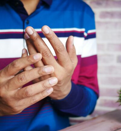 man suffering pain in hand close up